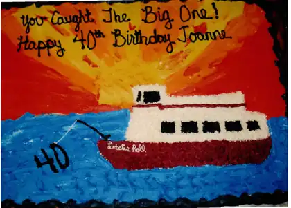 40th birthday cake with a boat at sunset