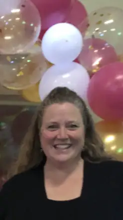 Brenda Schofield, owner of Brenda's Cakes For All Occasions, smiling in her kitchen