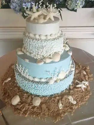 Blue and white beach wedding cake with starfish