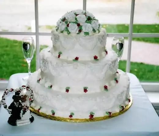 White tiered wedding cake with sugar flowers