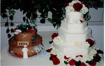 Groom's cake with grill and Red Sox theme beside a wedding cake