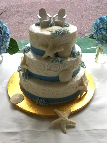 Beach themed wedding cake with starfish and shells