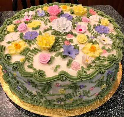 Cake covered in handmade buttercream flowers