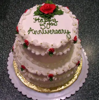 50th anniversary two-tier cake with red roses