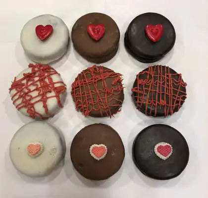 Chocolate covered Oreos with heart decorations