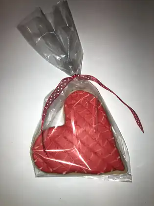Heart shaped sugar cookie in a gift bag