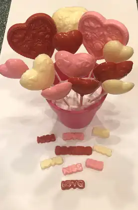 Chocolate heart lollipops in a pot