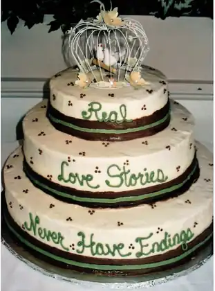 Wedding cake with ribbon and script lettering