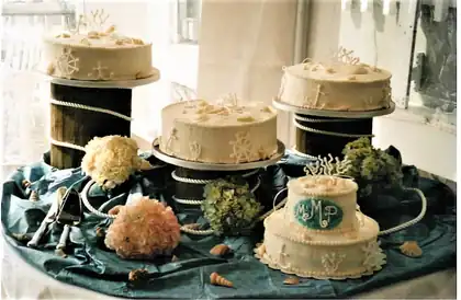 Wedding dessert presentation with small cakes on rustic stands
