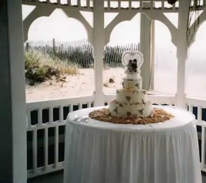 Gazebo wedding cake on a draped table